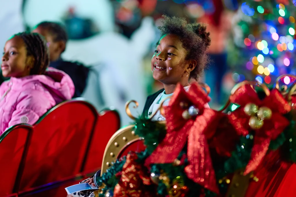 A child enjoying the holiday decorations at Winter Wonderland