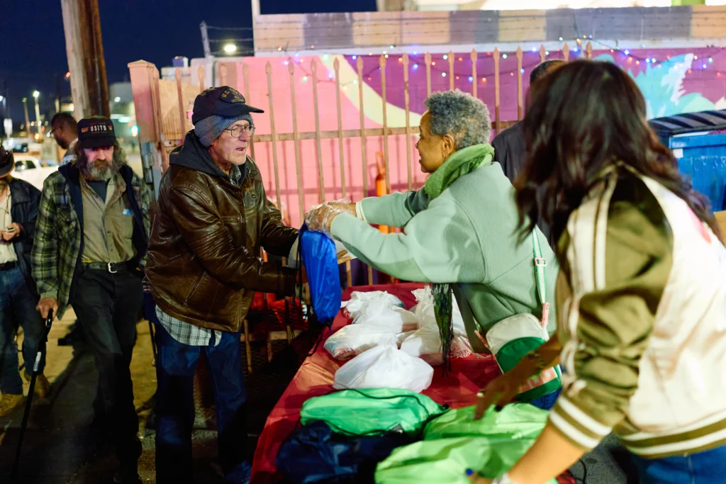 CARE Complex volunteers distributing essentials to community members